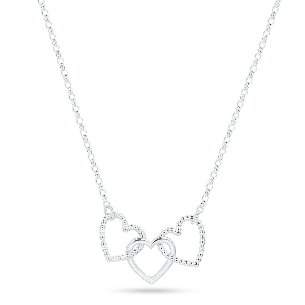 A silver Cariad necklace by Elin Mair featuring three interlocking open heart pendants, with two textured hearts and one polished heart, suspended from a delicate cable chain against a white background.