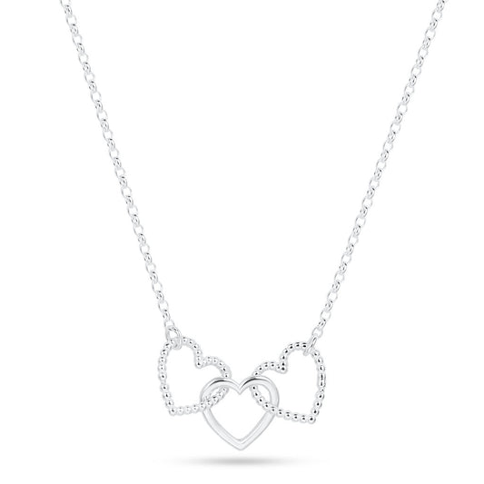 A silver Cariad necklace by Elin Mair featuring three interlocking open heart pendants, with two textured hearts and one polished heart, suspended from a delicate cable chain against a white background.