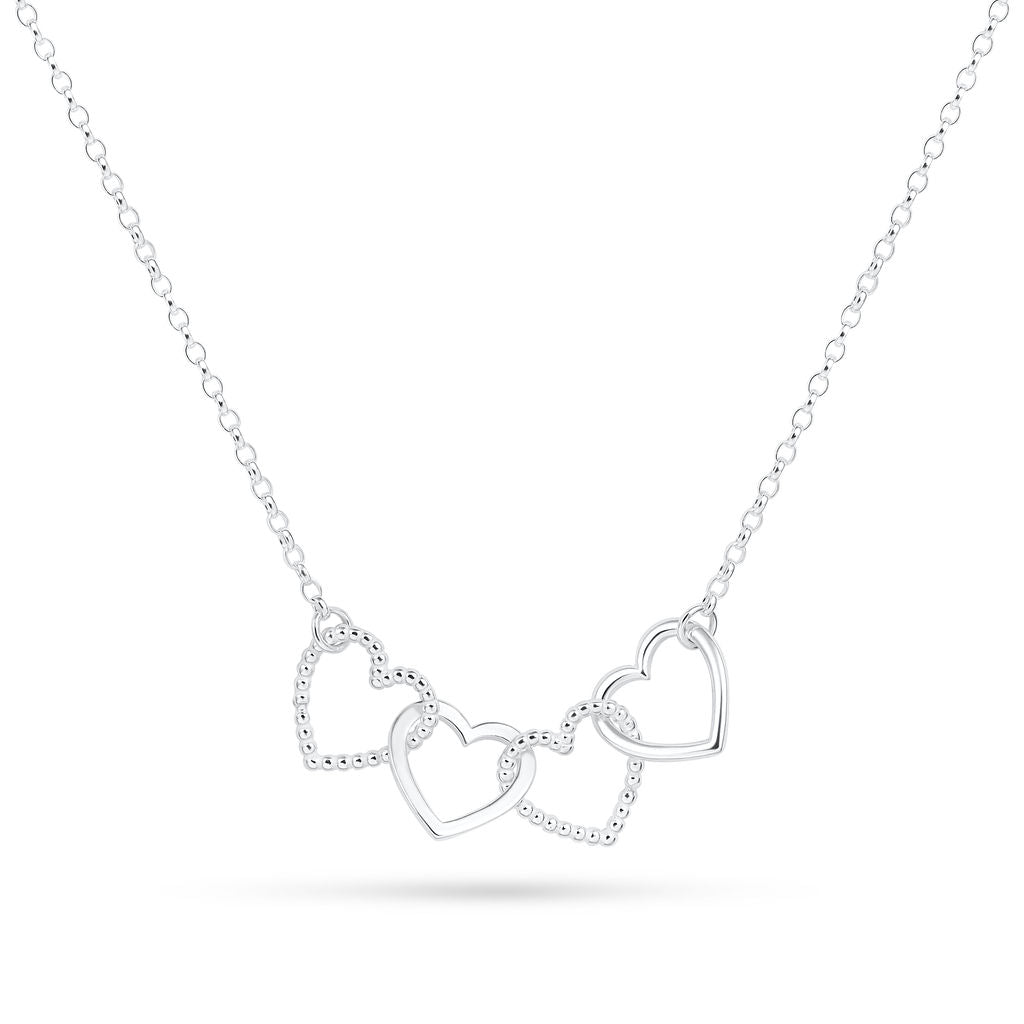 A silver Cariad necklace by Elin Mair featuring three interlocking open heart pendants on a delicate chain, shown against a plain white background.