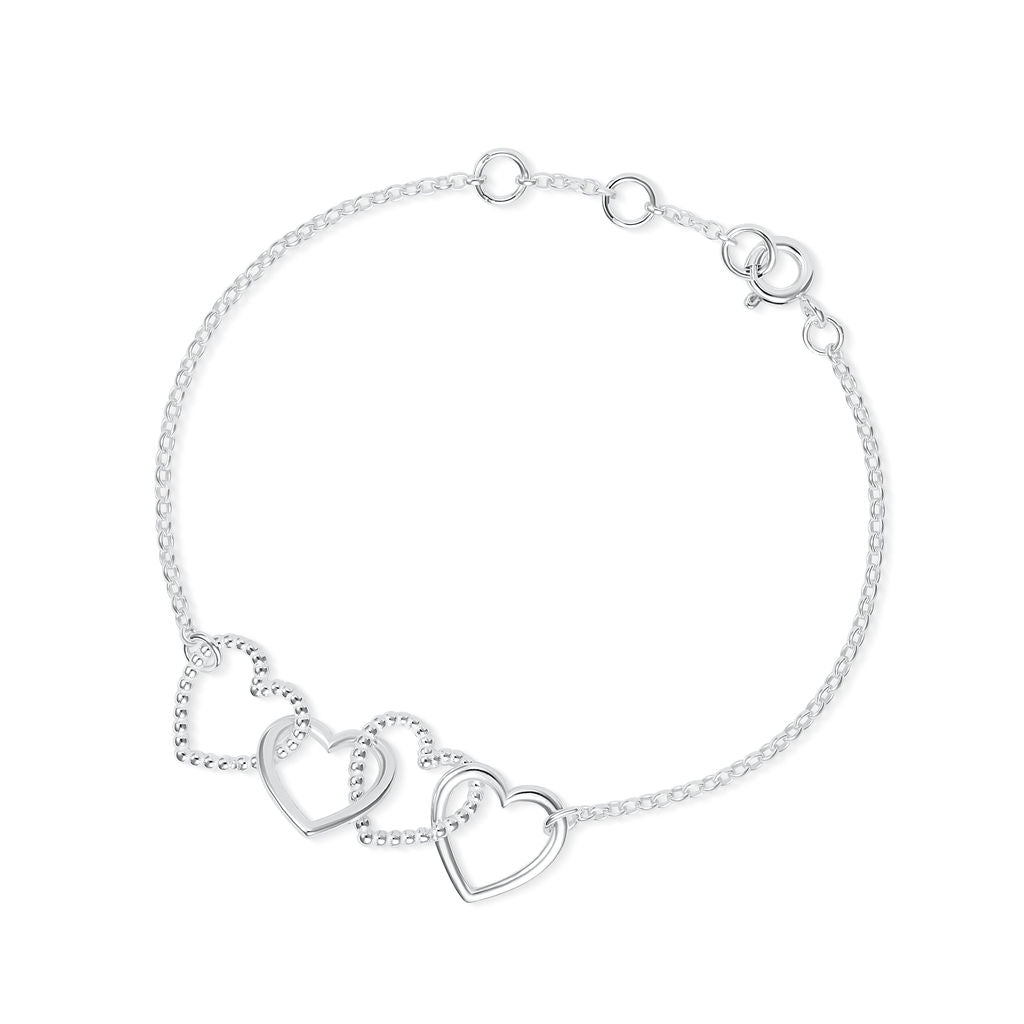 A delicate silver chain Cariad bracelet by Elin Mair featuring three interlocking open heart charms, displayed on a clean white background.